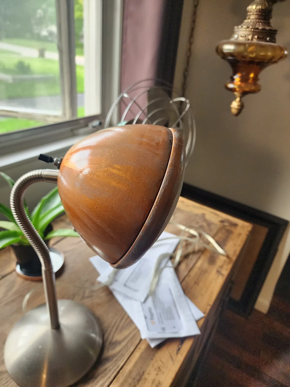 Antique car bucket light repurposed into a table lamp.